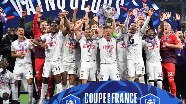 PARIS, FRANCE - APRIL 29:PARIS, FRANCE - APRIL 29: Brecht Dejaegere #10 of Toulouse FC lifts the French Final Cup Trophy with his teammates after the FC Nantes and Toulouse FC match at Stade de France on April 29, 2023 in Paris, France