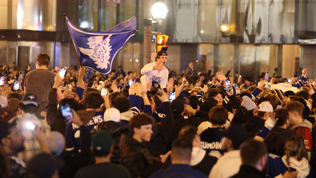TORONTO, ON- APRIL 29 - Fan take over the intersection of Bremner and York Streets after the win. Toronto Maple Leafs fans erupt in joy as the Leafs win in overtime in game 6 of their first round NHL playoffs series against Tampa Bay Lightning outside Scotiabank Arena in Toronto. April 29, 2023. (Steve Russell/Toronto Star via Getty Images)