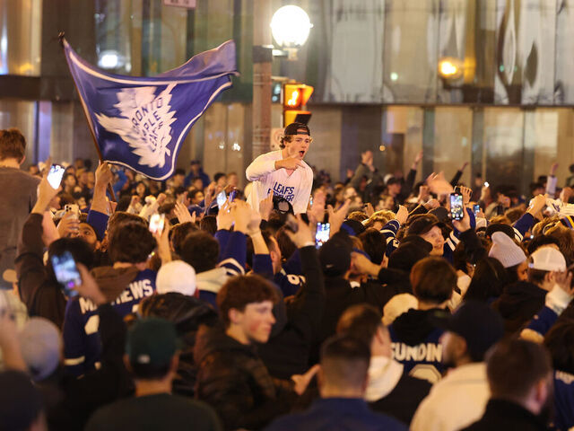 TORONTO, ON- APRIL 29 - Fan take over the intersection of Bremner and York Streets after the win. Toronto Maple Leafs fans erupt in joy as the Leafs win in overtime in game 6 of their first round NHL playoffs series against Tampa Bay Lightning outside Scotiabank Arena in Toronto. April 29, 2023. (Steve Russell/Toronto Star via Getty Images)