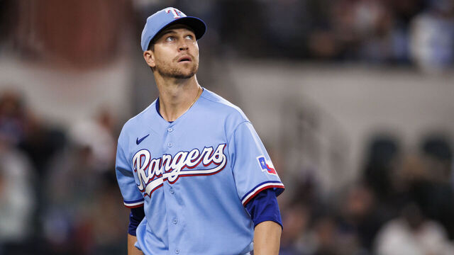 ARLINGTON, TX - APRIL 23: Jacob deGrom #48 of the Texas Rangers returns to the dugout after his eleventh strikeout to end the inning during a game against the Oakland Athletics at Globe Life Field on April 23, 2023 in Arlington, Texas.