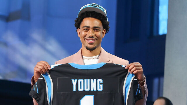 KANSAS CITY, MO - APRIL 27: Alabama QB Bryce Young holds up a jersey as the first overall pick in the NFL Draft Red Carpet event on April 27, 2023 at Union Station in Kansas City, MO.