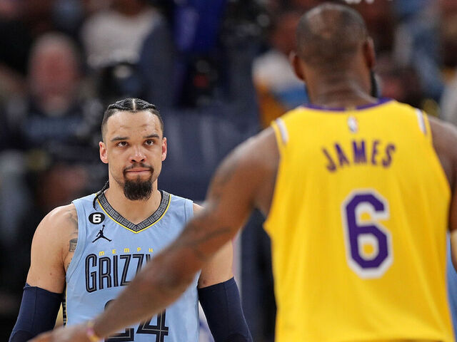 MEMPHIS, TENNESSEE - APRIL 26: Dillon Brooks #24 of the Memphis Grizzlies looks at LeBron James #6 of the Los Angeles Lakers during the second half of Game Five of the Western Conference First Round Playoffs at FedExForum on April 26, 2023 in Memphis, Tennessee.