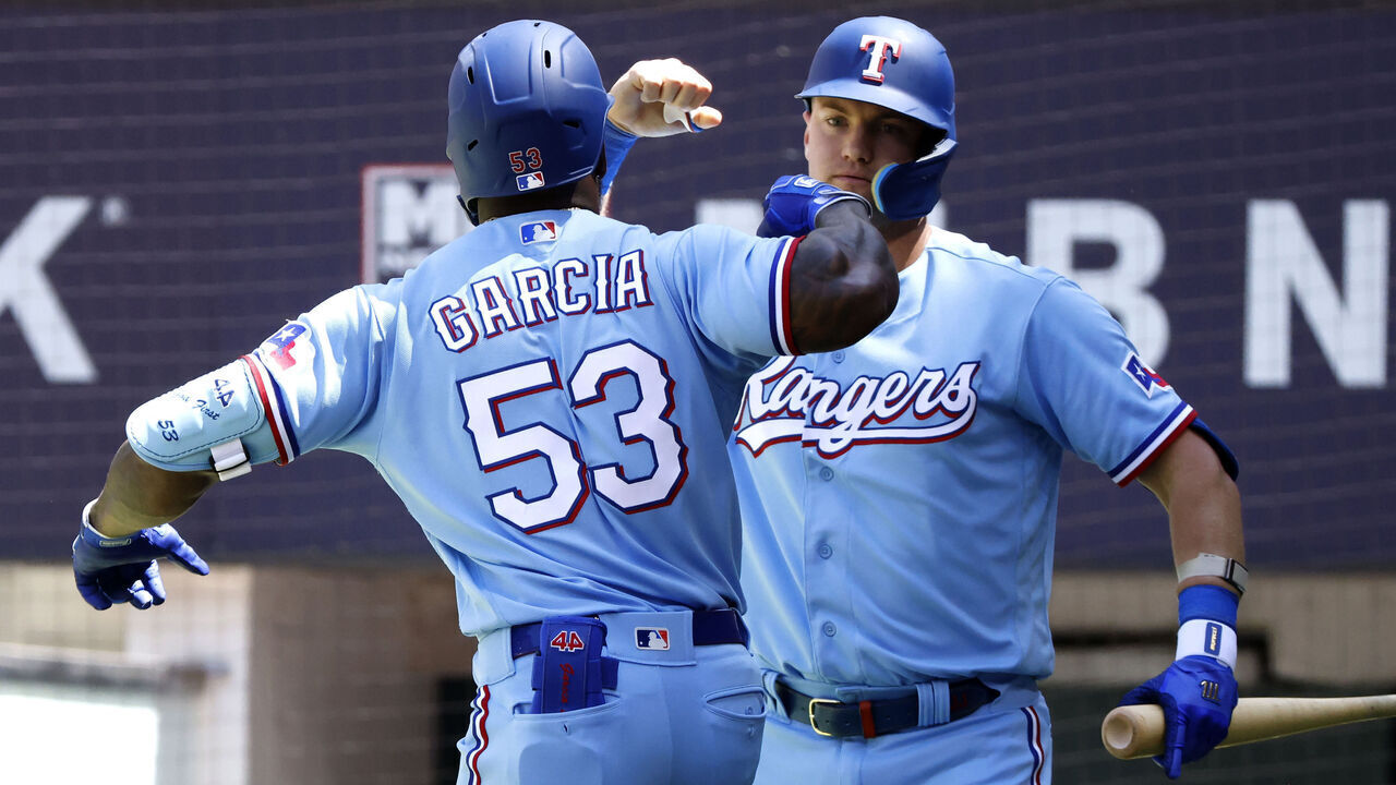 ARLINGTON, TX - APRIL 30: Adolis Garcia #53 of the Texas Rangers celebrates with teammate Josh Jung #6 after hitting a solo home run against the New York Yankees during the fifth inning at Globe Life Field on April 30, 2023 in Arlington, Texas.