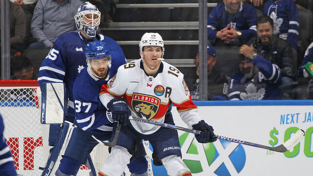 TORONTO, CANADA - JANUARY 17: Timothy Liljegren #37 of the Toronto Maple Leafs tries to contain Matthew Tkachuk #19 of the Florida Panthers during an NHL game at Scotiabank Arena on January 17, 2023 in Toronto, Ontario, Canada.