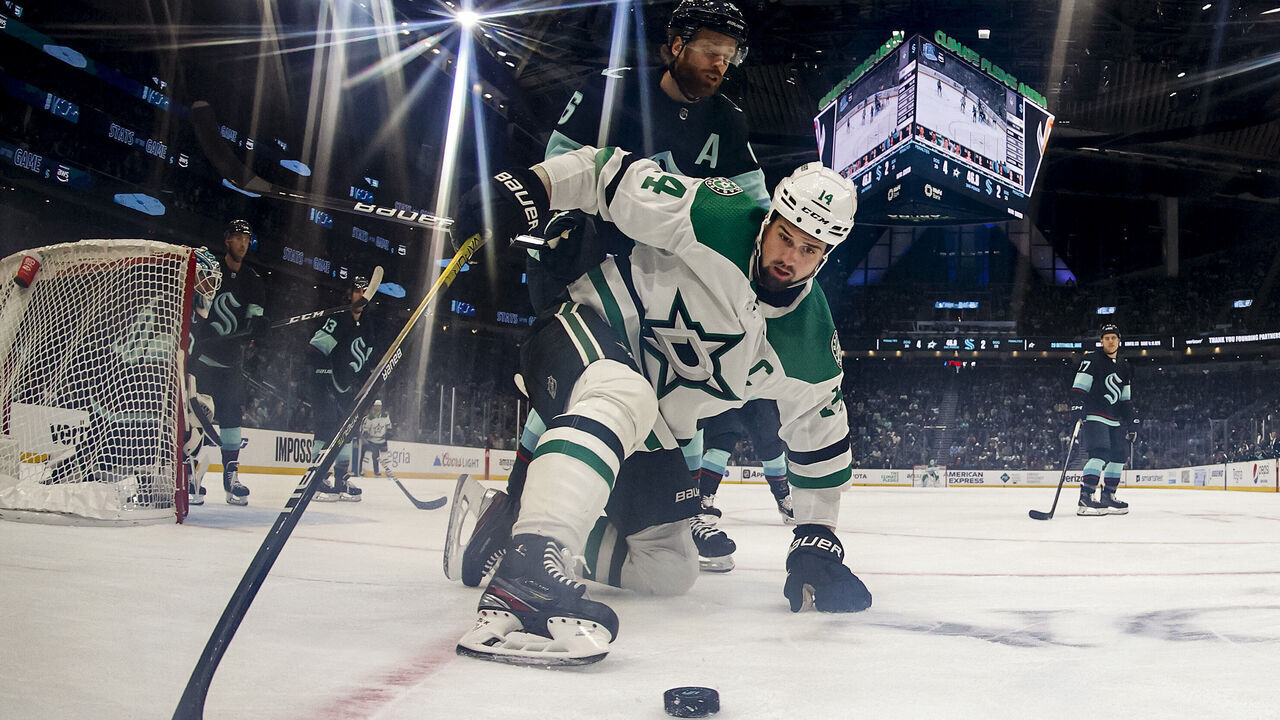 SEATTLE, WASHINGTON - MARCH 13: Jamie Benn #14 of the Dallas Stars controls the puck against Adam Larsson #6 of the Seattle Kraken during the second period at Climate Pledge Arena on March 13, 2023 in Seattle, Washington.