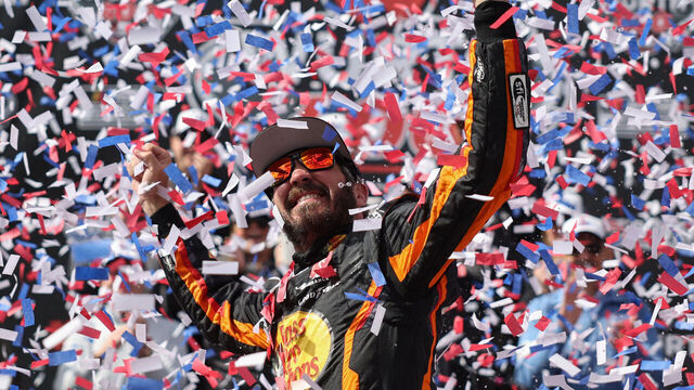 DOVER, DELAWARE - MAY 01: Martin Truex Jr., driver of the #19 Bass Pro Shops Toyota, celebrates in victory lane after winning the NASCAR Cup Series Würth 400 at Dover International Speedway on May 01, 2023 in Dover, Delaware.