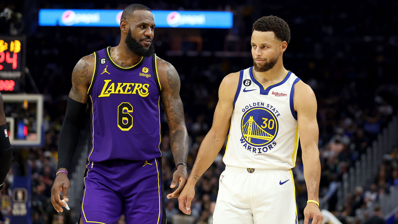 SAN FRANCISCO, CALIFORNIA - OCTOBER 18: LeBron James #6 of the Los Angeles Lakers speaks to Stephen Curry #30 of the Golden State Warriors during their game at Chase Center on October 18, 2022 in San Francisco, California.