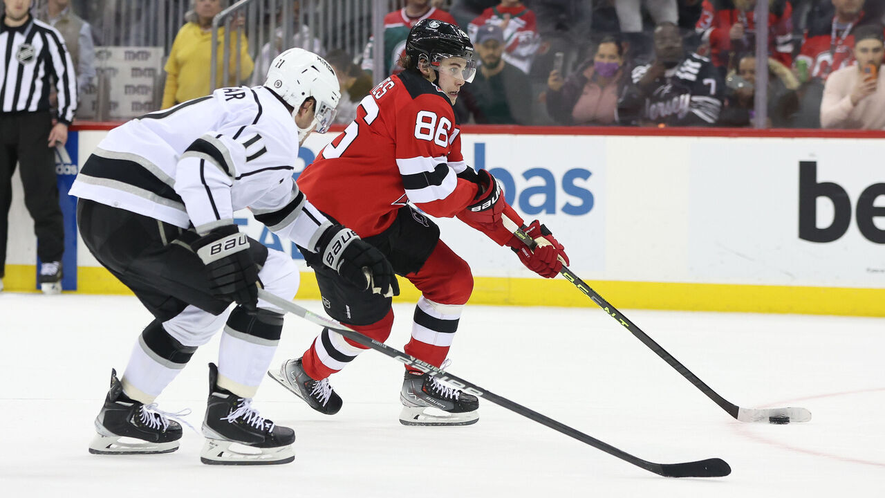 NEWARK, NJ - FEBRUARY 23: New Jersey Devils center Jack Hughes (86) skates by Los Angeles Kings center Anze Kopitar (11) during the National Hockey League game between the Los Angeles Kings and the New Jersey Devils on February 23, 2023 at Prudential Center in Newark, NJ.