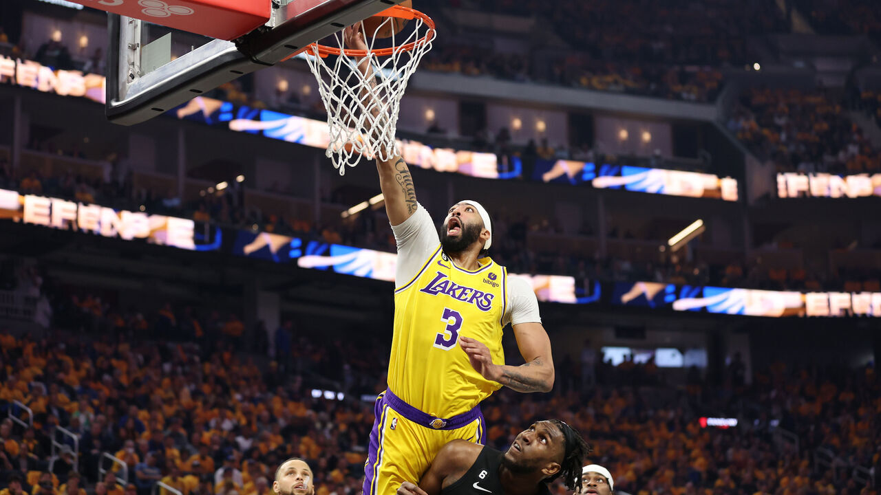 SAN FRANCISCO, CALIFORNIA - MAY 02: Anthony Davis #3 of the Los Angeles Lakers drives to the basket against Kevon Looney #5 of the Golden State Warriors during the first quarter in game one of the Western Conference Semifinal Playoffs at Chase Center on May 02, 2023 in San Francisco, California.