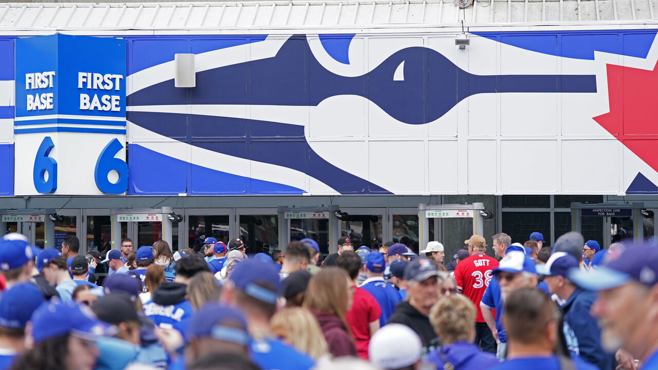 TORONTO, ON - APRIL 11: Toronto Blue Jays fans walk outside of the stadium prior to the game between the Detroit Tigers and the Toronto Blue Jays at Rogers Centre on Tuesday, April 11, 2023 in Toronto, Canada.