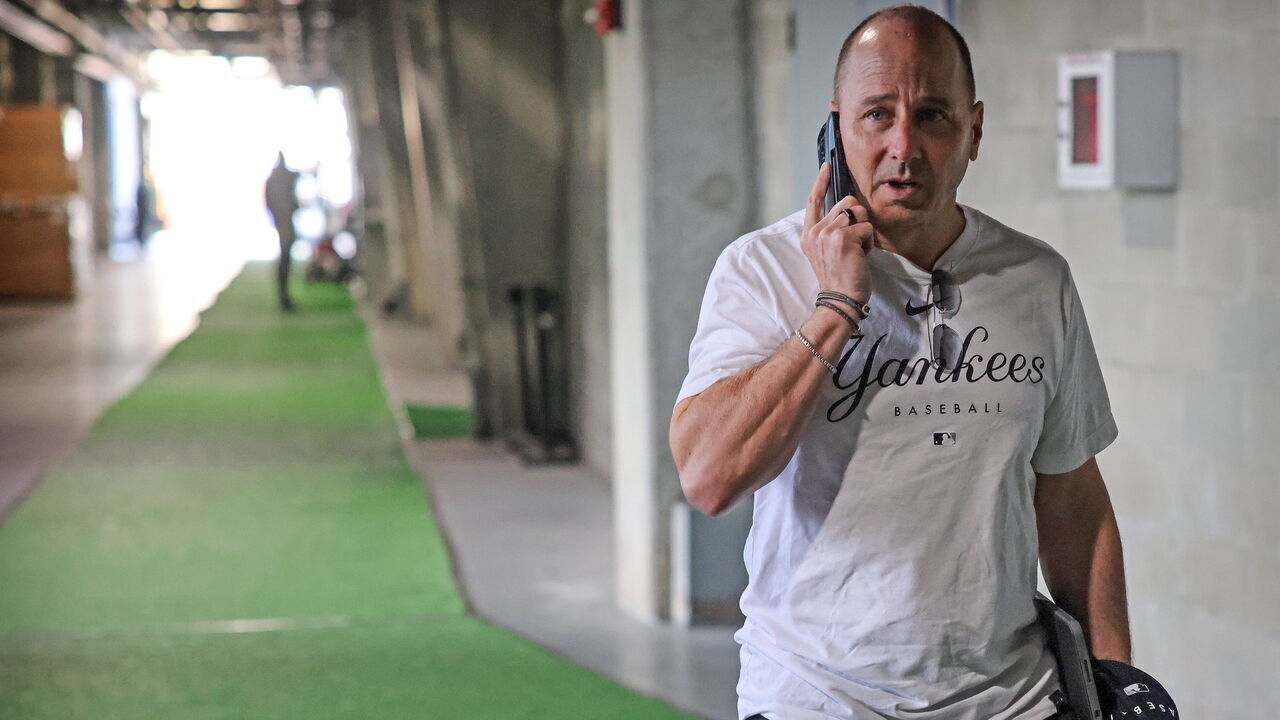 Tampa, Florida: New York Yankees General Manager Brian Cashman speaks on the phone during day five of Yankee Spring Training at George M. Steinbrenner field in Tampa, Florida on February 19, 2023.