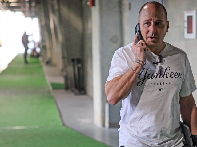 Tampa, Florida: New York Yankees General Manager Brian Cashman speaks on the phone during day five of Yankee Spring Training at George M. Steinbrenner field in Tampa, Florida on February 19, 2023.