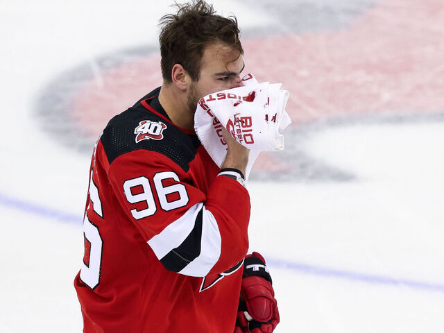 NEWARK, NJ - MAY 01: New Jersey Devils right wing Timo Meier (96) holds a towel to his face after getting hit during Game 7 of an Eastern Conference First Round playoff game between the New York Rangers and the New Jersey Devils on May 1, 2023, at Prudential Center in Newark, New Jersey.