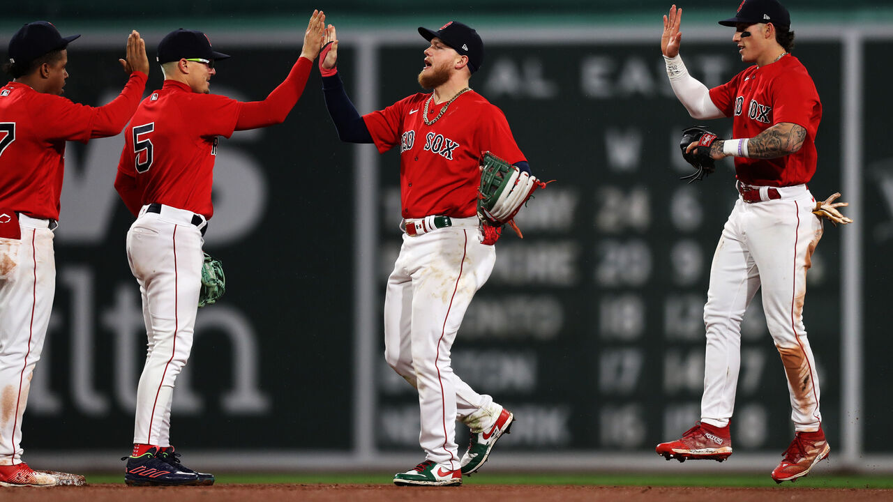 BOSTON, MASSACHUSETTS - MAY 03: Alex Verdugo #99 of the Boston Red Sox and Enrique Hernandez #5 of the Boston Red Sox high-five after the victory over the Toronto Blue Jays at Fenway Park on May 03, 2023 in Boston, Massachusetts.