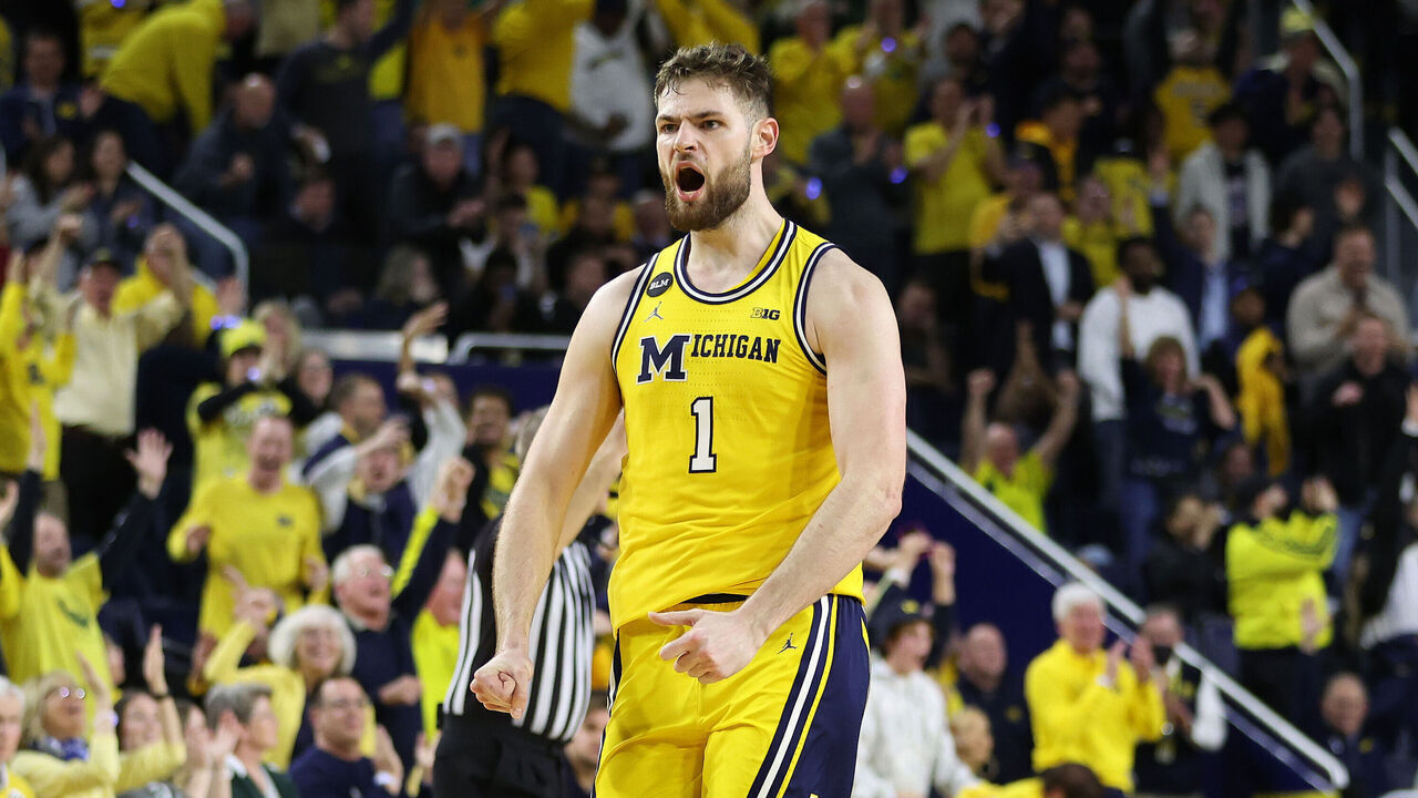 ANN ARBOR, MICHIGAN - FEBRUARY 18: Hunter Dickinson #1 of the Michigan Wolverines reacts after a late second half three point basket against the Michigan State Spartans at Crisler Arena on February 18, 2023 in Ann Arbor, Michigan. Michigan won the game 84-72.