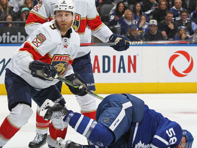 TORONTO, CANADA- MAY4: Sam Bennett #9 of the Florida Panthers takes a cross checking penalty against Michael Bunting #58 of the Toronto Maple Leafs during Game Two of the Second Round of the 2023 Stanley Cup Playoffs at Scotiabank Arena on May 4, 2023 in Toronto, Ontario, Canada. The Panthers defeated the Maple Leafs 3-2.