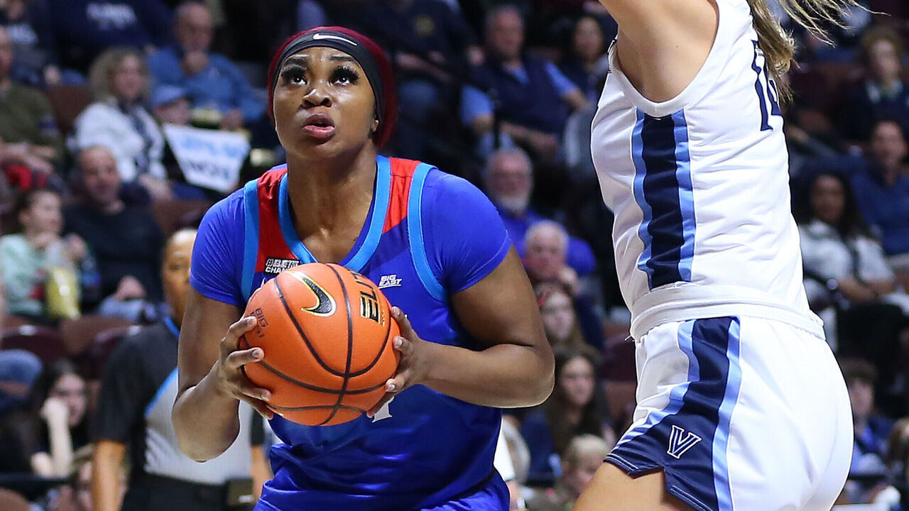 UNCASVILLE, CT - MARCH 04: DePaul Blue Demons forward Aneesah Morrow (24) drives to the basket against Villanova Wildcats forward Megan Olbrys (14) during the Big East Women's Basketball Tournament game between DePaul Blue Demons and Villanova Wildcats on March 4, 2023, at Mohegan Sun Arena in Uncasville, CT.