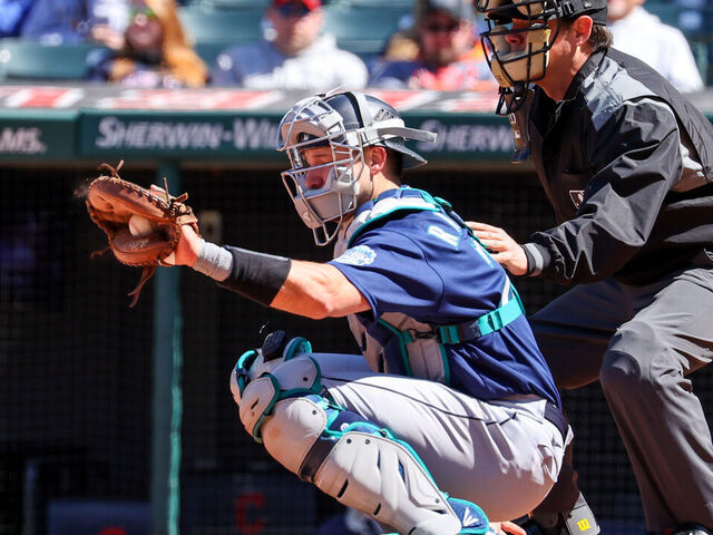 CLEVELAND, OH - APRIL 09: Seattle Mariners catcher Cal Raleigh (29) and home plate umpire DJ Reyburn (17) during the fifth inning of the Major League Baseball game between the Seattle Mariners and Cleveland Guardians on April 9, 2023, at Progressive Field in Cleveland, OH.