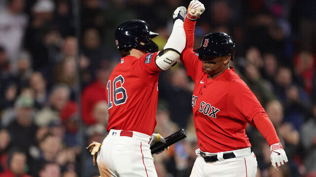 BOSTON, MASSACHUSETTS - MAY 04: Rafael Devers #11 of the Boston Red Sox celebrates with Jarren Duran #16 after hitting a two run home run against the Toronto Blue Jays during the eighth inning at Fenway Park on May 04, 2023 in Boston, Massachusetts.