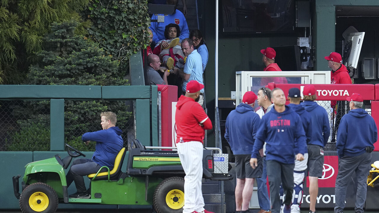 PHILADELPHIA, PA - MAY 5: Medical staff tend to a fan who fell into the bullpen in the top of the first inning of the game during the game between the Boston Red Sox and Philadelphia Phillies at Citizens Bank Park on May 5, 2023 in Philadelphia, Pennsylvania.