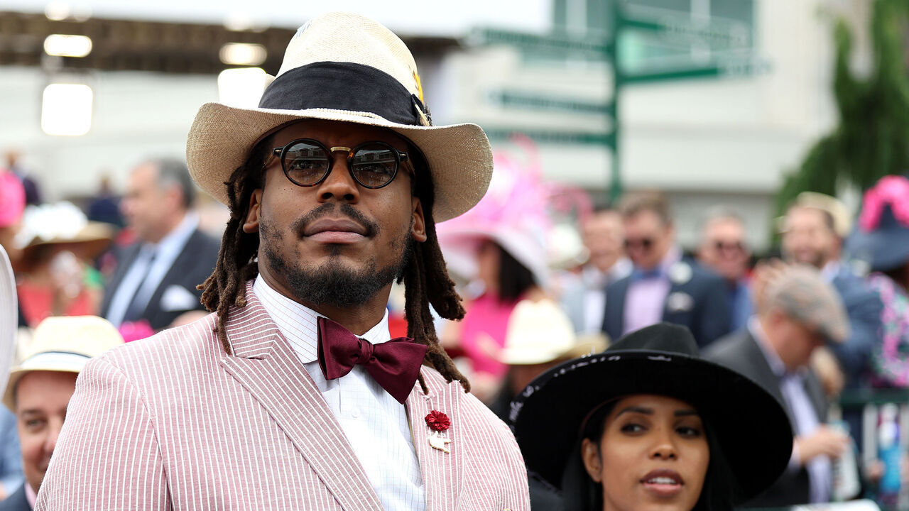 LOUISVILLE, KENTUCKY - MAY 07: NFL player Cam Newton watches an undercard race before the running of the 148th Kentucky Derby at Churchill Downs on May 07, 2022 in Louisville, Kentucky.