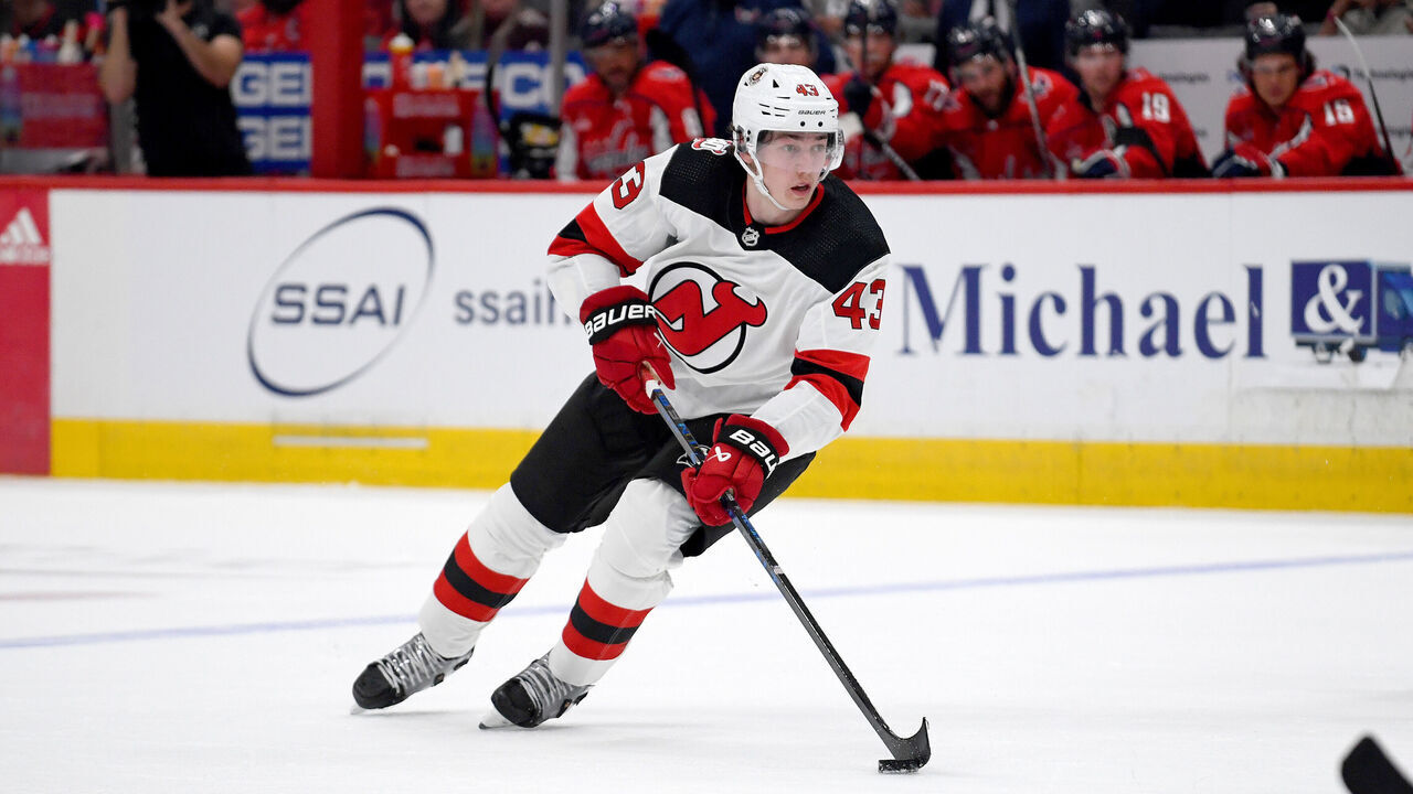 WASHINGTON, DC - APRIL 13: Devils defenseman Luke Hughes (43) stickhandles into the offensive zone during the New Jersey Devils versus Washington Capitals National Hockey League game on April 13, 2023 at Capital One Arena in Washington, D.C..