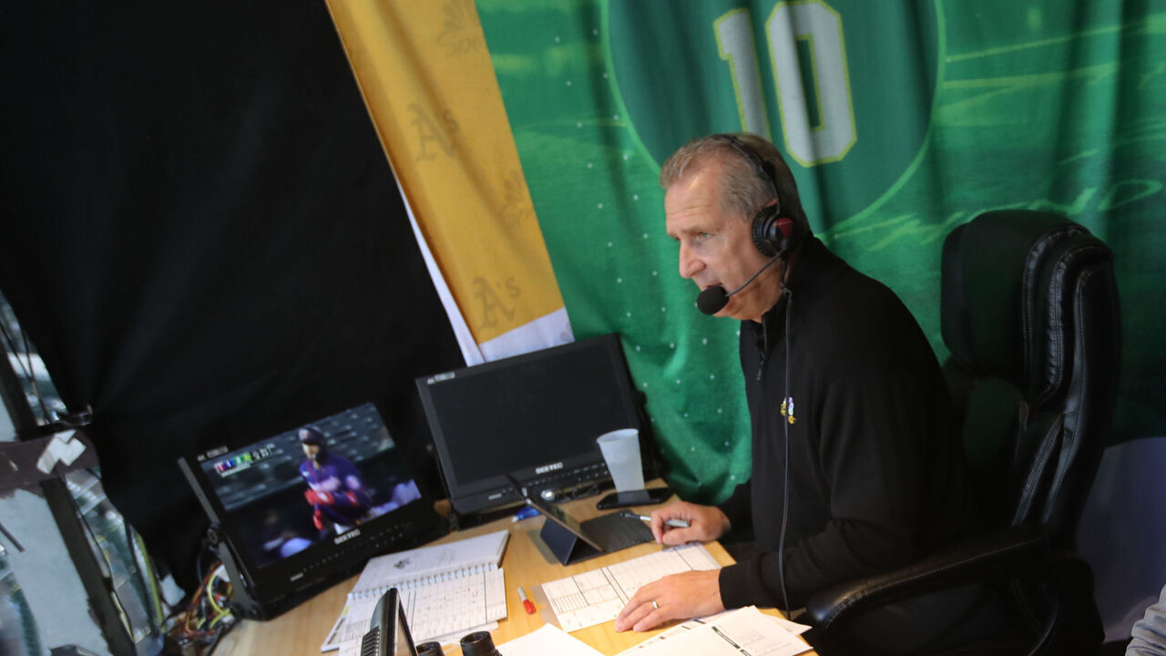 OAKLAND, CA - MAY 17: Broadcasters Glen Kuiper and Dallas Braden of the Oakland Athletics in the TV booth during the game against the Minnesota Twins at RingCentral Coliseum on May 17, 2022 in Oakland, California. The Athletics defeated the Twins 5-2.
