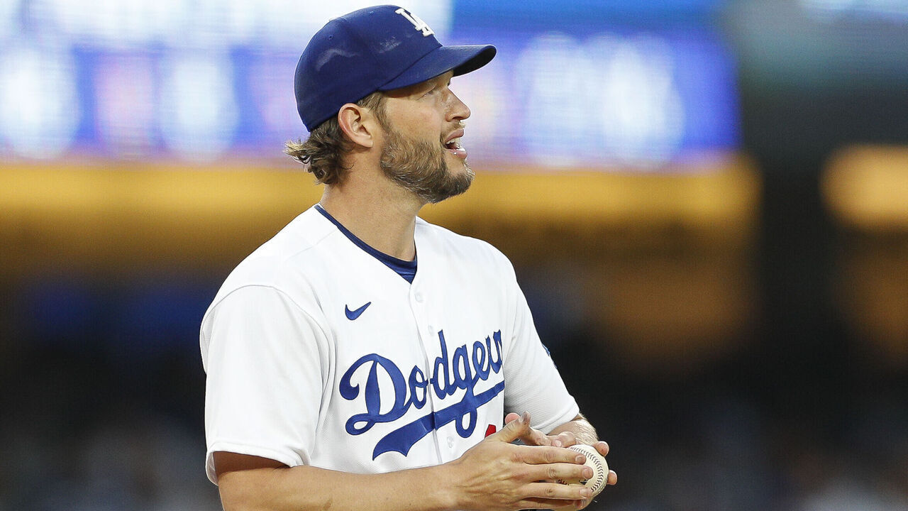 LOS ANGELES, CA - APRIL 29: Los Angeles Dodgers starting pitcher Clayton Kershaw (22) rubs a new baseball during a regular season game between the St. Louis Cardinals and Los Angeles Dodgers on April 29, 2023 at Dodger Stadium in Los Angeles, CA.