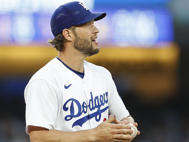 LOS ANGELES, CA - APRIL 29: Los Angeles Dodgers starting pitcher Clayton Kershaw (22) rubs a new baseball during a regular season game between the St. Louis Cardinals and Los Angeles Dodgers on April 29, 2023 at Dodger Stadium in Los Angeles, CA.