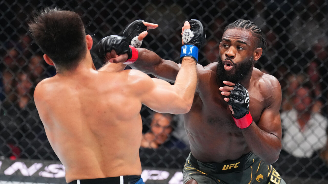 NEWARK, NEW JERSEY - MAY 06: (R-L) Aljamain Sterling punches Henry Cejudo in the UFC bantamweight championship fight during the UFC 288 event at Prudential Center on May 06, 2023 in Newark, New Jersey.