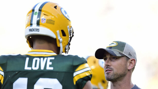 GREEN BAY, WISCONSIN - AUGUST 14: Head coach Matt LaFleur of the Green Bay Packers talks with Jordan Love #10 before the preseason game against the Houston Texans at Lambeau Field on August 14, 2021 in Green Bay, Wisconsin.