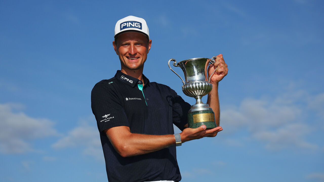 ROME, ITALY - MAY 07: Adrian Meronk of Poland poses with the trophy following victory on Day Four of the DS Automobiles Italian Open at Marco Simone Golf Club on May 07, 2023 in Italy.