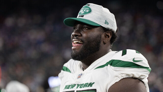 EAST RUTHERFORD, NJ - AUGUST 14: Mekhi Becton #77 of the New York Jets on the sideline during the fourth quarter of a preseason game against the New York Giants at MetLife Stadium on August 14, 2021 in East Rutherford, New Jersey.