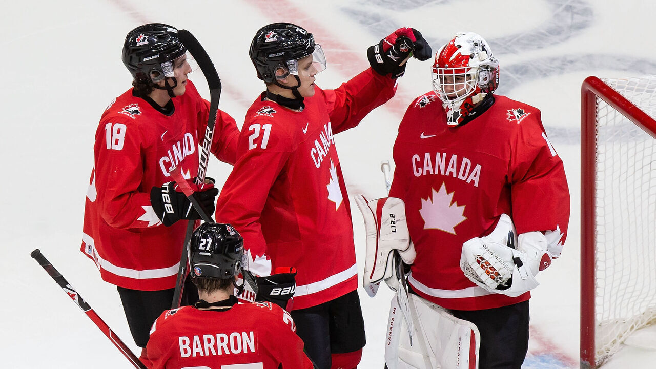 EDMONTON, AB - JANUARY 02: Peyton Krebs #18, Justin Barron #27, Kaiden Guhle #21 and goaltender Devon Levi #1 of Canada celebrate their victory against the Czech Republic during the 2021 IIHF World Junior Championship quarterfinals at Rogers Place on January 2, 2021 in Edmonton, Canada.