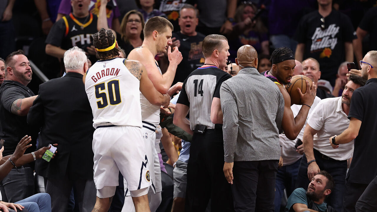 PHOENIX, ARIZONA - MAY 07: Nikola Jokic #15 of the Denver Nuggets has an altercation in the stands during the first half of Game Four of the NBA Western Conference Semifinals at Footprint Center on May 07, 2023 in Phoenix, Arizona.