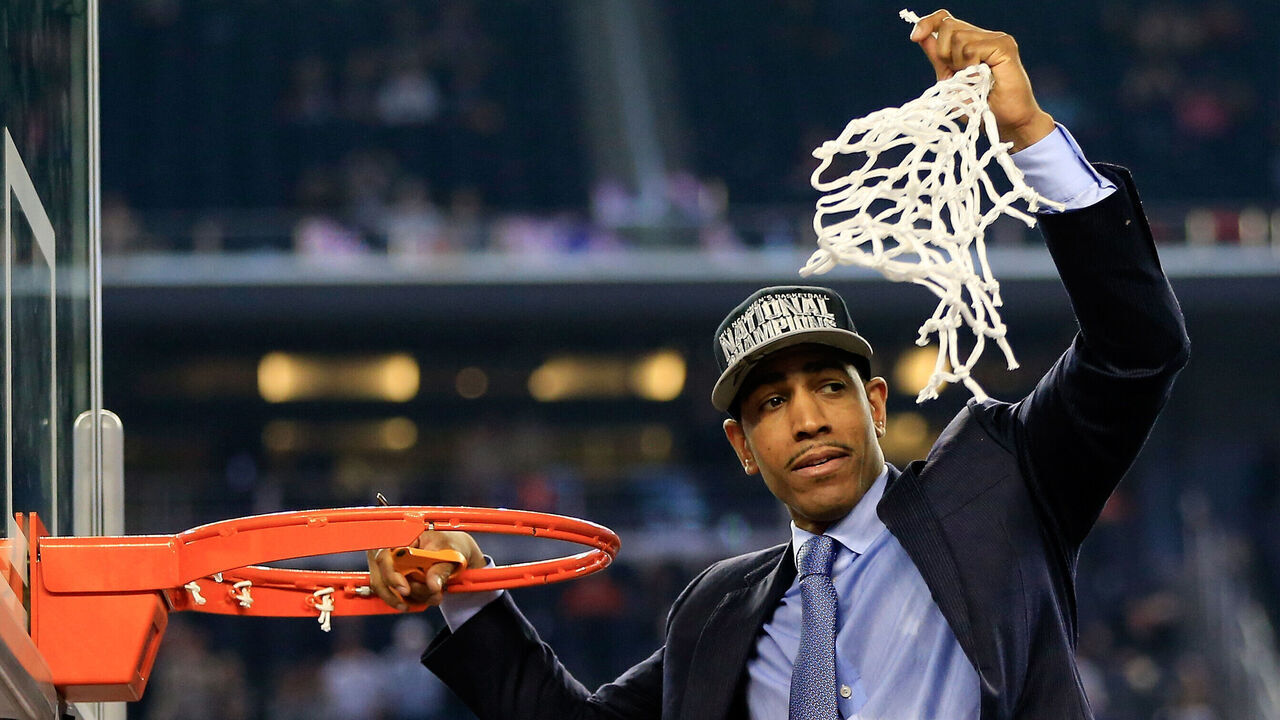 ARLINGTON, TX - APRIL 07: Head coach Kevin Ollie of the Connecticut Huskies cuts down the net after defeating the Kentucky Wildcats 60-54 in the NCAA Men's Final Four Championship at AT&T Stadium on April 7, 2014 in Arlington, Texas.
