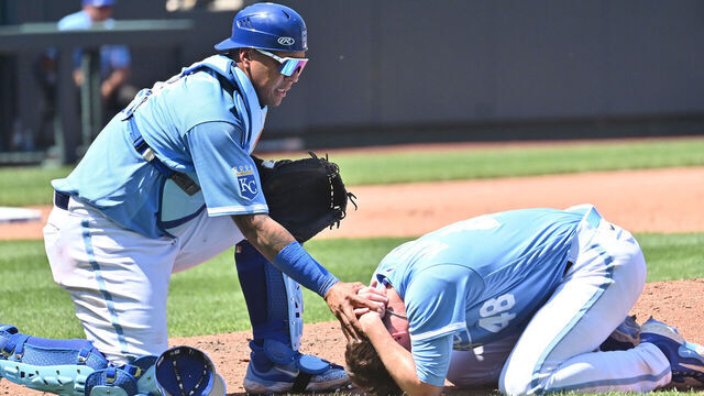 KANSAS CITY, MO - MAY 07: Kansas City Royals catcher Salvador Perez (13) checks out the condition of Kansas City Royals starting pitcher Ryan Yarbrough (48) after he was hit in the face by a line drive during an MLB game between the Oakland Athletics and the Kansas City Royals on May 07, 2023, at Kauffman Stadium, in Kansas City, MO.