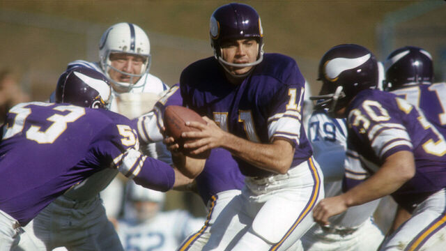 MINNEAPOLIS, MN - OCTOBER 22: Quarterback Joe Kapp #11 of the Minnesota Vikings turns to hand the ball off to a running back against the Baltimore Colts during an NFL football game at Metropolitan Stadium October 22, 1967 in Minneapolis, Minnesota. Kapp played for the Vikings from 1967-69.