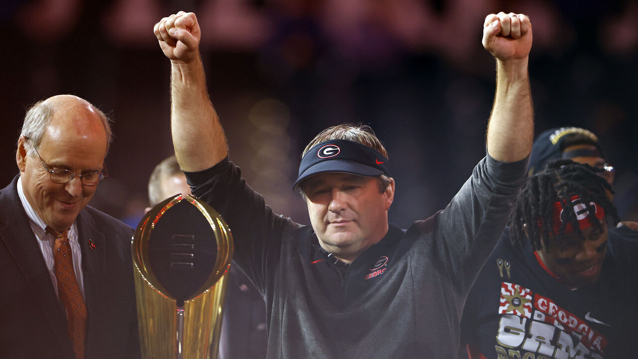 INGLEWOOD, CALIFORNIA - JANUARY 09: head coach Kirby Smart of the Georgia Bulldogs raises the College Football Playoff National Championship Trophy after defeating the TCU Horned Frogs in the College Football Playoff National Championship game at SoFi Stadium on January 09, 2023 in Inglewood, California. Georgia defeated TCU 65-7.