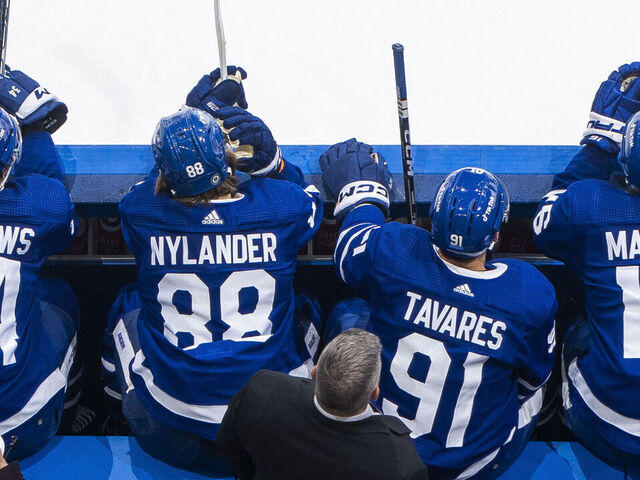 TORONTO, ON - DECEMBER 13: Mitchell Marner #16, Auston Matthews #34, John Tavares #91, and William Nylander #88 of the Toronto Maple Leafs sit on the bench against the Anaheim Ducks during the first period at the Scotiabank Arena on December 13, 2022 in Toronto, Ontario, Canada.