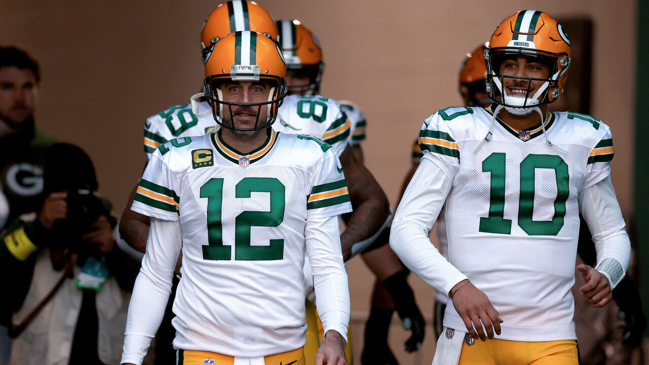 MIAMI GARDENS, FLORIDA - DECEMBER 25: Aaron Rodgers #12 and Jordan Love #10 of the Green Bay Packers take the field prior to a game against the Miami Dolphins at Hard Rock Stadium on December 25, 2022 in Miami Gardens, Florida.