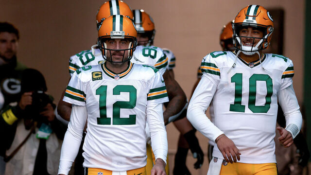 MIAMI GARDENS, FLORIDA - DECEMBER 25: Aaron Rodgers #12 and Jordan Love #10 of the Green Bay Packers take the field prior to a game against the Miami Dolphins at Hard Rock Stadium on December 25, 2022 in Miami Gardens, Florida.