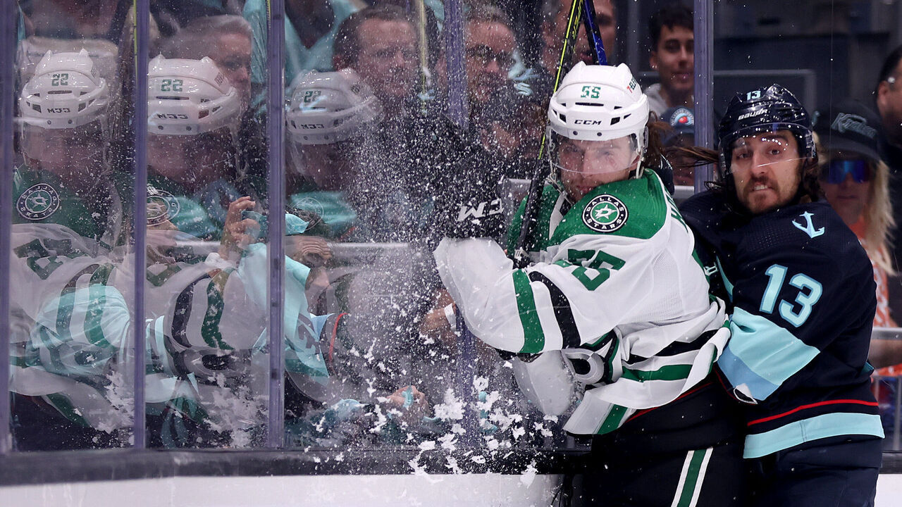 SEATTLE, WASHINGTON - MAY 09: Brandon Tanev #13 of the Seattle Kraken checks Thomas Harley #55 of the Dallas Stars during the second period in Game Four of the Second Round of the 2023 Stanley Cup Playoffs at Climate Pledge Arena on May 09, 2023 in Seattle, Washington.