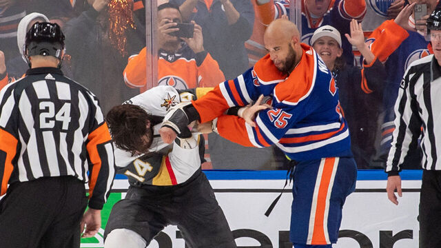 EDMONTON, CANADA - MAY 10: Darnell Nurse #25 of the Edmonton Oilers fights Nicolas Hague #14 of the Vegas Golden Knights in the third period of Game Four of the Second Round of the 2023 Stanley Cup Playoffs at Rogers Place on May 10, 2023, in Edmonton, Alberta, Canada.