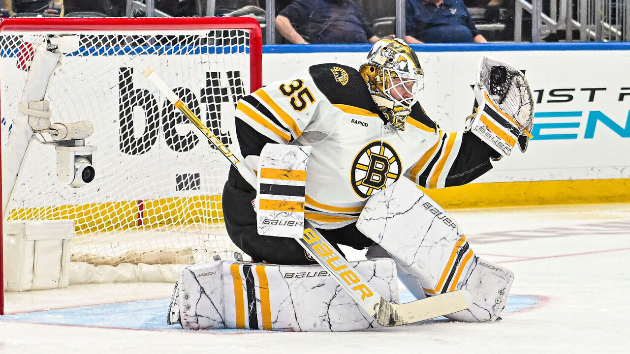 ST. LOUIS, MO - APRIL 02: Boston Bruins goaltender Linus Ullmark (35) makes a glove save during a game between the Boston Bruins and the St. Louis Blues on April 02 2023, at the Enterprise Center in St. Louis MO