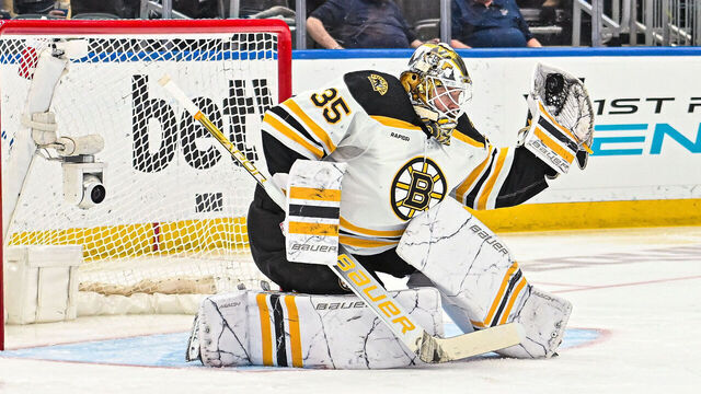 ST. LOUIS, MO - APRIL 02: Boston Bruins goaltender Linus Ullmark (35) makes a glove save during a game between the Boston Bruins and the St. Louis Blues on April 02 2023, at the Enterprise Center in St. Louis MO