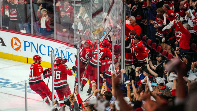RALEIGH, NORTH CAROLINA - MAY 11: The Carolina Hurricanes celebrate after a 3-2 victory in overtime against the New Jersey Devils in Game Five of the Second Round of the 2023 Stanley Cup Playoffs at PNC Arena on May 11, 2023 in Raleigh, North Carolina.