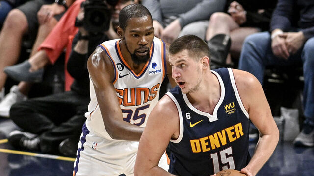 DENVER, CO - MAY 1: Nikola Jokic (15) of the Denver Nuggets backs down Kevin Durant (35) of the Phoenix Suns during the second quarter at Ball Arena in Denver on Monday, May 1, 2023.