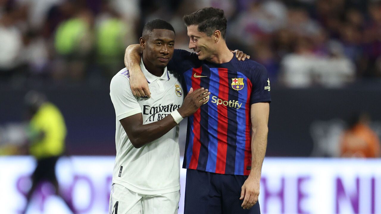LAS VEGAS, NV - JULY 23: David Alaba #4 of Real Madrid and Robert Lewandowski #12 of Barcelona talk during the preseason friendly match between Real Madrid and Barcelona at Allegiant Stadium on July 23, 2022 in Las Vegas, Nevada.