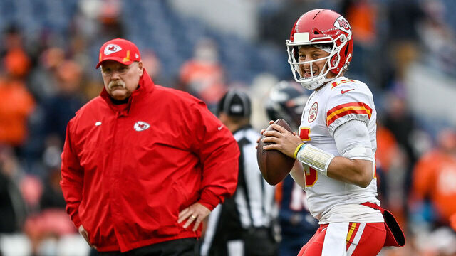 DENVER, COLORADO - JANUARY 08: Patrick Mahomes #15 of the Kansas City Chiefs warms up near head coach Andy Reid prior to facing the Denver Broncos at Empower Field At Mile High on January 08, 2022 in Denver, Colorado.